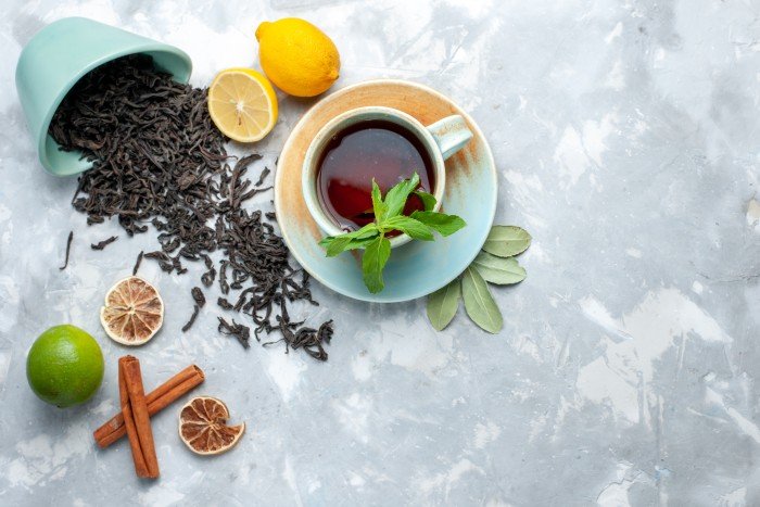 Dentist treating a patient in a modern dental clinic, with ‘Herbal Tea Dealer’ as the target keyword